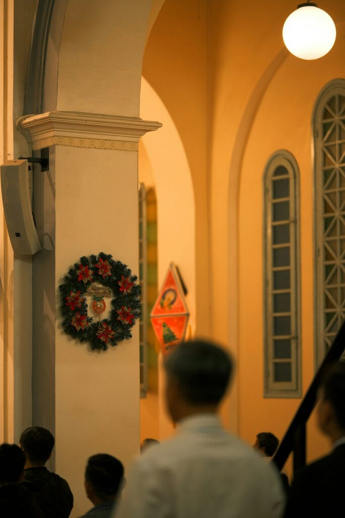Christmas wreath on a pillar inside a church